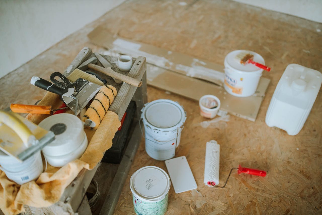Mastering the First Impression: Your intriguing post title goes here Overhead shot of tools and paint supplies for a home renovation project.